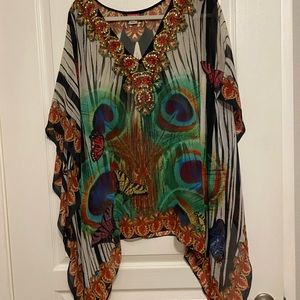 Tunic or swimsuit coverup, either way is glamorous. Ranee’s brand